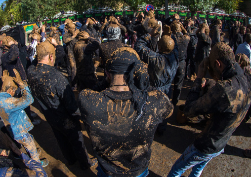 Iranian Shiite Muslim Men Covered In Mud, Chanting And Self-flagellating During Ashura, The Day Of The Death Of Imam Hussein, Kurdistan Province, Bijar, Iran