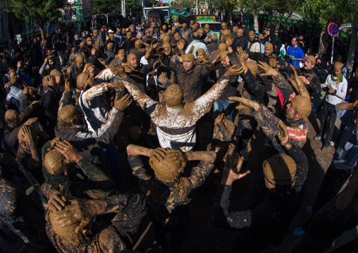 Iranian Shiite Muslim Men Covered In Mud, Chanting And Self-flagellating During Ashura, The Day Of The Death Of Imam Hussein, Kurdistan Province, Bijar, Iran