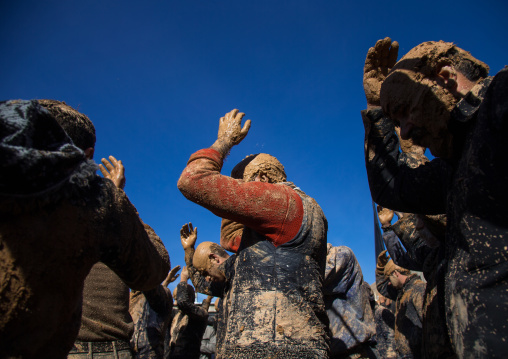 Iranian Shiite Muslim Men Covered In Mud, Chanting And Self-flagellating During Ashura, The Day Of The Death Of Imam Hussein, Kurdistan Province, Bijar, Iran