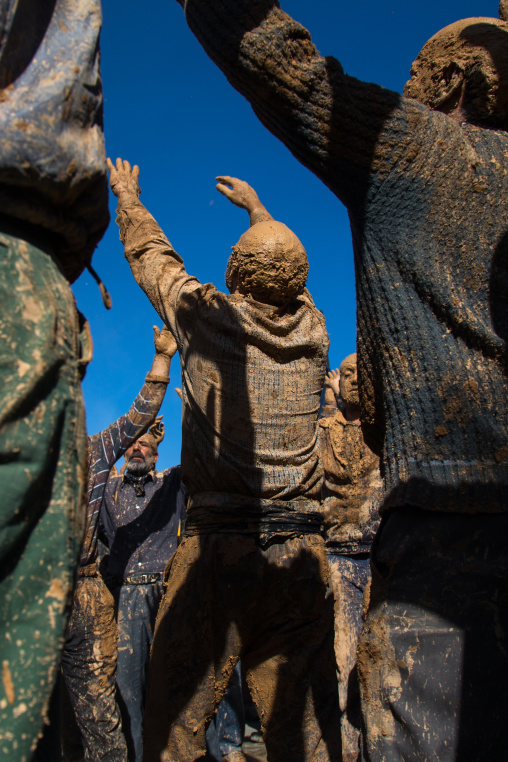 Iranian Shiite Muslim Men Covered In Mud, Chanting And Self-flagellating During Ashura, The Day Of The Death Of Imam Hussein, Kurdistan Province, Bijar, Iran