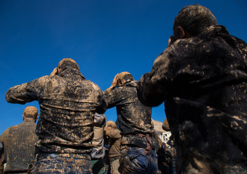 Iranian Shiite Muslim Men Covered In Mud, Chanting And Self-flagellating During Ashura, The Day Of The Death Of Imam Hussein, Kurdistan Province, Bijar, Iran