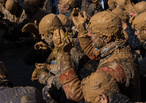 Iranian Shiite Muslim Men Covered In Mud, Chanting And Self-flagellating During Ashura Day, Kurdistan Province, Bijar, Iran