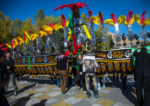 An Iranian Man Carries An Alam Is Helped By Shiite Muslim Mourners To Keep His Balance On Ashura, The Day Of The Death Of Hussein, Kurdistan Province, Bijar, Iran