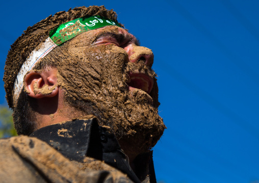 Iranian Shiite Muslim Man Covered In Mud Crying During Ashura Day, Kurdistan Province, Bijar, Iran