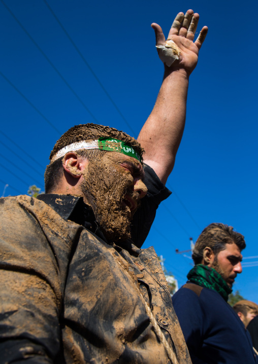 Iranian Shiite Muslim Men Covered In Mud Crying During Ashura Day, Kurdistan Province, Bijar, Iran