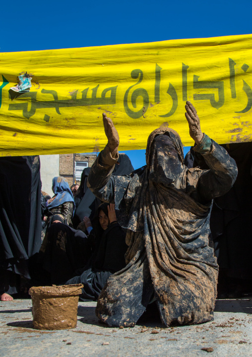 Iranian Shiite Muslim Woman Covered In Mud, Chanting And Self-flagellating During Ashura, The Day Of The Death Of Imam Hussein, Kurdistan Province, Bijar, Iran