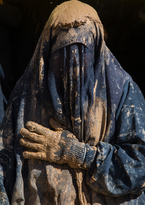 Iranian Shiite Muslim Woman Covered In Mud With Her Hand On Her Heart During Ashura, The Day Of The Death Of Imam Hussein, Kurdistan Province, Bijar, Iran