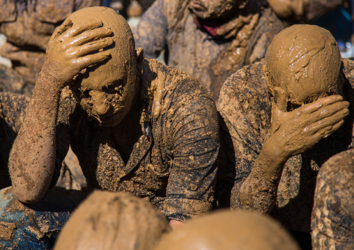 Iranian Shiite Muslim Men Covered In Mud Crying Together During Ashura, The Day Of The Death Of Imam Hussein, Kurdistan Province, Bijar, Iran