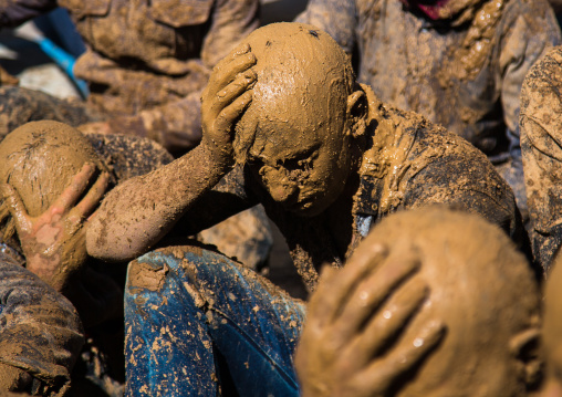 Iranian Shiite Muslim Men Covered In Mud Crying Together During Ashura, The Day Of The Death Of Imam Hussein, Kurdistan Province, Bijar, Iran