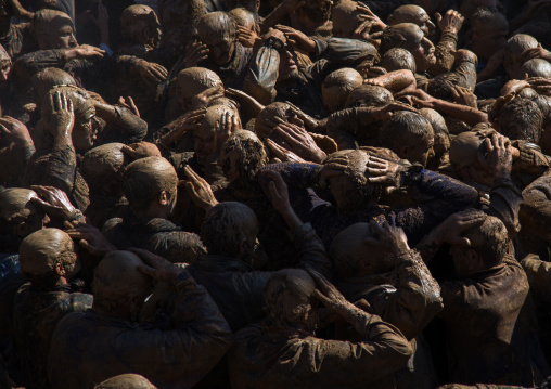 Iranian Shiite Muslim Men Covered In Mud, Chanting And Self-flagellating During Ashura, The Day Of The Death Of Imam Hussein, Kurdistan Province, Bijar, Iran