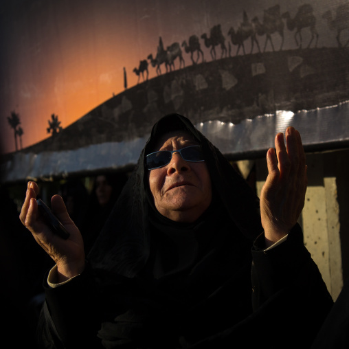 Iranian Shiite Muslim Old Woman Praying With Hands Raised During Ashura Celebration, The Day Of The Death Of Imam Hussein, Kurdistan Province, Bijar, Iran