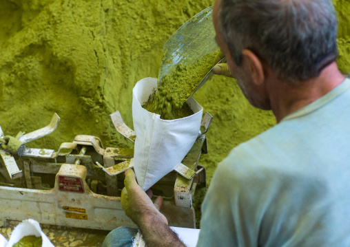 Iranian Worker Packing Henna Bags In A Traditional Mill, Yazd Province, Yazd, Iran