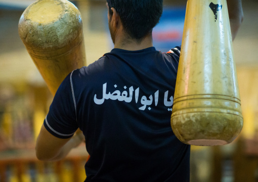 Iranian Man Wielding Wooden Clubs During The Traditional Sport Of Zurkhaneh, Yazd Province, Yazd, Iran