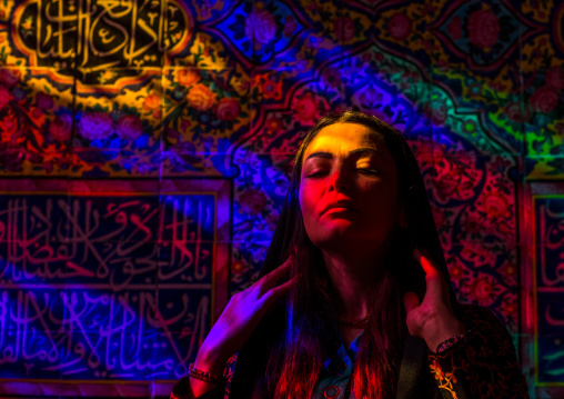 Iranian Woman Praying In The Nasir Ol Molk Mosque With Its Beautiful Coloured Glass Windows, Fars Province, Shiraz, Iran