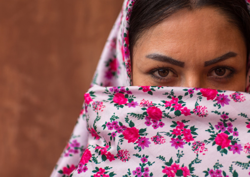 Portrait Of An Iranian Woman Wearing Traditional Floreal Chador In Zoroastrian Village, Isfahan Province, Abyaneh, Iran