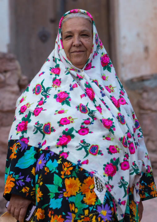 Portrait Of An Iranian Woman Wearing Traditional Floreal Chador In Zoroastrian Village, Isfahan Province, Abyaneh, Iran