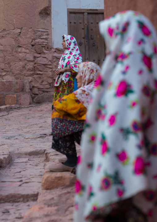 Portrait Of Iranian Women Wearing Traditional Floreal Chadors In Zoroastrian Village, Isfahan Province, Abyaneh, Iran