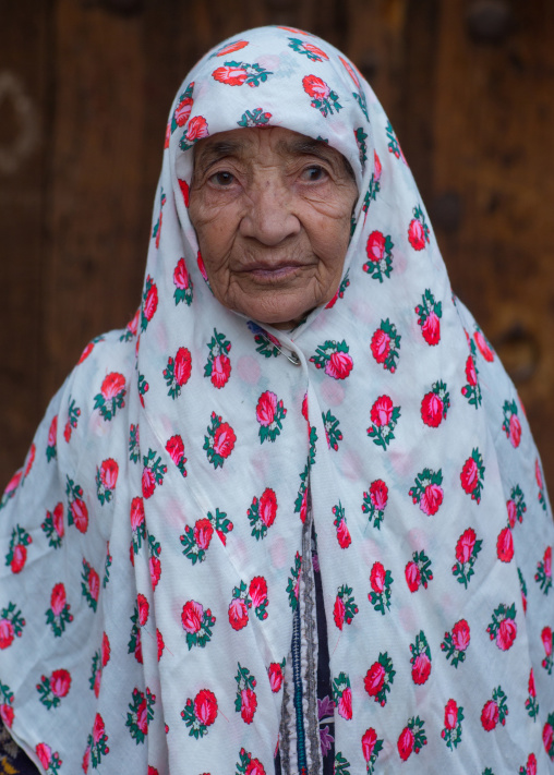 Portrait Of An Iranian Woman Wearing Traditional Floreal Chador In Zoroastrian Village, Isfahan Province, Abyaneh, Iran