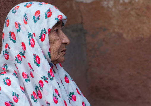 Portrait Of An Iranian Woman Wearing Traditional Floreal Chador In Zoroastrian Village, Isfahan Province, Abyaneh, Iran