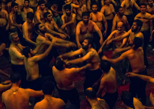 Iranian Shiite Muslim Mourners From The Mad Of Hussein Community Chanting And Self-flagellating During Muharram, Isfahan Province, Kashan, Iran