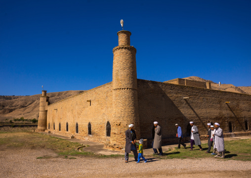 Iranian Shiite Men With A Child In Front Of An Old Caravanserai Turned Into Madrassah, Golestan Province, Karim Ishan, Iran