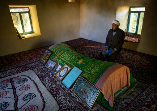 Iranian Shiite Iman Praying Inside A Shrine In Front Of A Tomb, Golestan Province, Karim Ishan, Iran