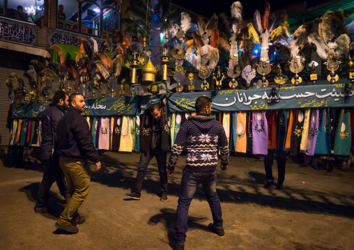 An Iranian Man Carries An Alam Is Helped By Shiite Muslim Mourners To Keep His Balance On Ashura, The Day Of The Death Of Hussein, Golestan Province, Gorgan, Iran