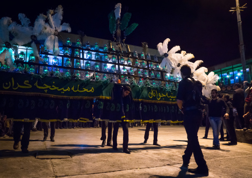 An Iranian Man Carries An Alam Is Helped By Shiite Muslim Mourners To Keep His Balance On Ashura, The Day Of The Death Of Hussein, Golestan Province, Gorgan, Iran