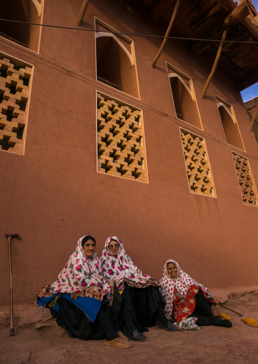 Portrait Of Iranian Women Wearing Traditional Floreal Chadors In Zoroastrian Village, Isfahan Province, Abyaneh, Iran