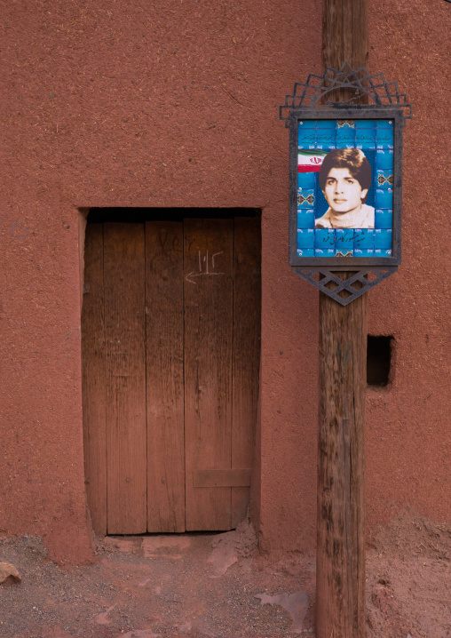 Sign Paying Homage To Martyr Fallen During The War Between Iran And Iraq In Front Of An Ancient Building In Zoroastrian Village, Isfahan Province, Abyaneh, Iran