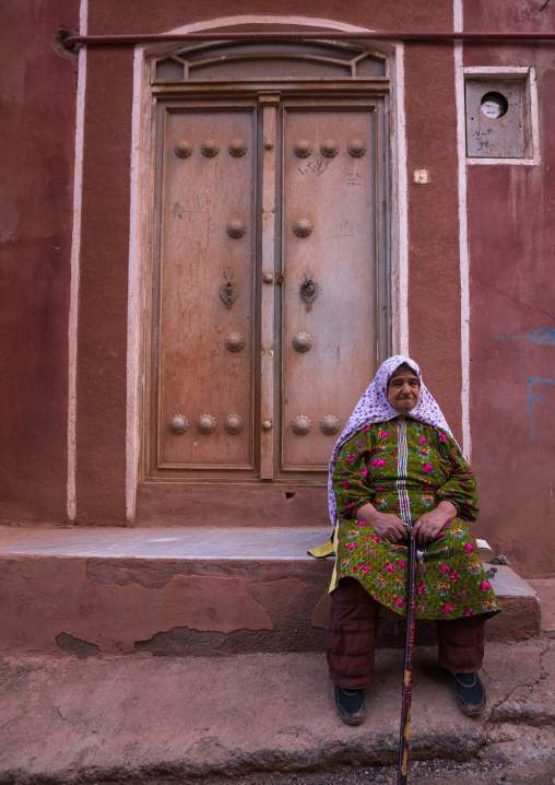 Portrait Of An Iranian Woman Wearing Traditional Floreal Chador In Zoroastrian Village, Isfahan Province, Abyaneh, Iran