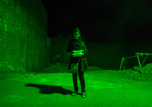 Iranian Shiite Muslim Girl Bringing Back Home Nazri Charity Food During Muharram, Isfahan Province, Kashan, Iran