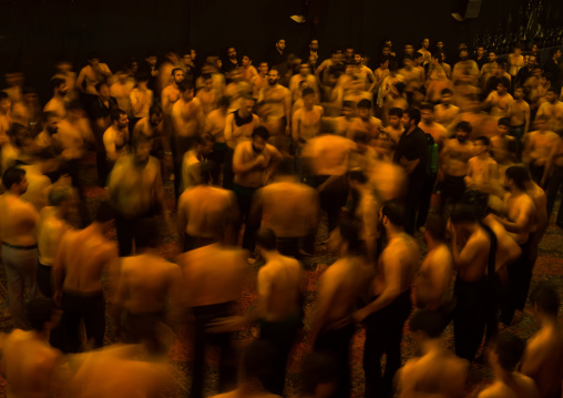 Iranian Shiite Muslim Mourners From The Mad Of Hussein Community Chanting And Self-flagellating In Circle During Muharram, Isfahan Province, Kashan, Iran