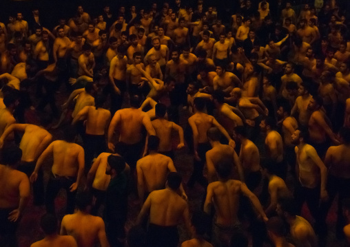 Iranian Shiite Muslim Mourners From The Mad Of Hussein Community Chanting And Self-flagellating In Circle During Muharram, Isfahan Province, Kashan, Iran