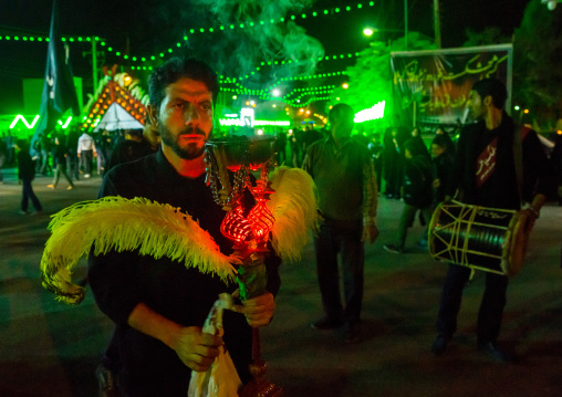 Iranian Shiite Muslim Man Holding An Incense Burner During Ashura, The Day Of The Death Of Imam Hussein, Isfahan Province, Kashan, Iran