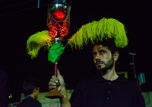 Iranian Shiite Muslim Man Holding An Incense Burner During Ashura, The Day Of The Death Of Imam Hussein, Isfahan Province, Kashan, Iran