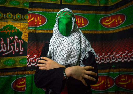 Iranian Young Man With Green Veil Covering His Face During Chehel Menbari Festival On Tasua To Commemorate The Martyrdom Of Hussein, Lorestan Province, Khorramabad, Iran