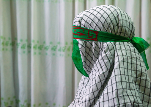 Iranian Young Man With Green Veil Covering His Face During Chehel Menbari Festival On Tasua To Commemorate The Martyrdom Of Hussein, Lorestan Province, Khorramabad, Iran