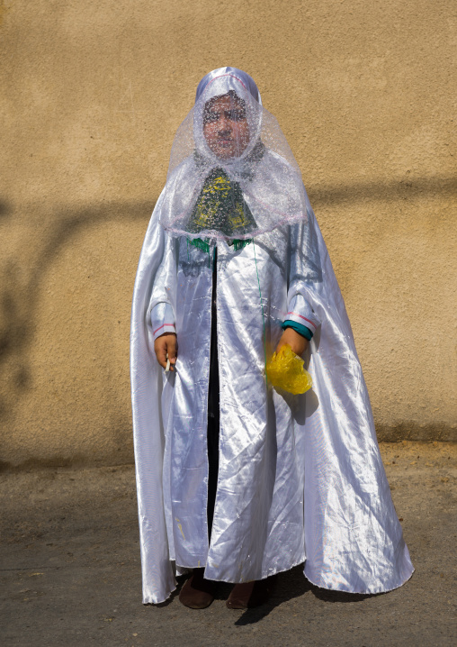 Iranian Shiite Muslim Girl Mourning Imam Hussein On The Day Of Tasua With Her Face Covered By A Veil, Lorestan Province, Khorramabad, Iran