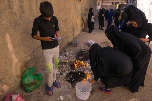 Iranian Women Light Candles During Chehel Menbari Festival On Tasua To Commemorate The Martyrdom Anniversary Of Hussein, Lorestan Province, Khorramabad, Iran