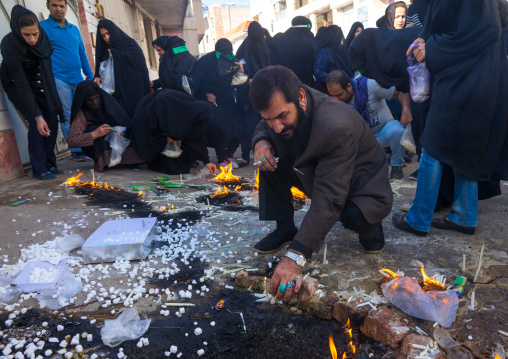 A Man Lights Candles During Chehel Menbari Festival On Tasu'a Day To Commemorate The Martyrdom Anniversary Of Imam Hussein, Lorestan Province, Khorramabad, Iran