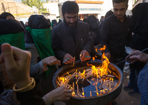 A Man Lights Candles During Chehel Menbari Festival On Tasu'a Day To Commemorate The Martyrdom Anniversary Of Imam Hussein, Lorestan Province, Khorramabad, Iran