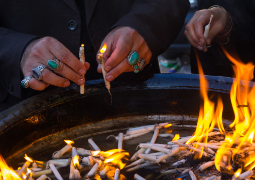 A Man Lights Candles During Chehel Menbari Festival Ton Tasu'a Day To Commemorate The Martyrdom Anniversary Of Imam Hussein, Lorestan Province, Khorramabad, Iran