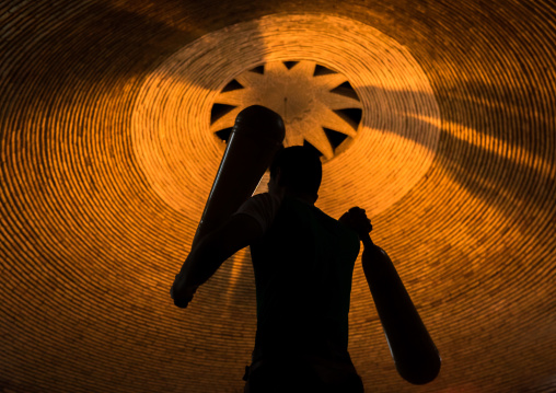 Iranian Man Wielding Wooden Clubs During The Traditional Sport Of Zurkhaneh, Yazd Province, Yazd, Iran