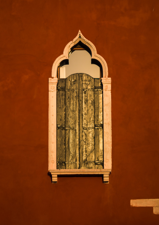 Venetian window on a red historic house, Veneto Region, Venice, Italy