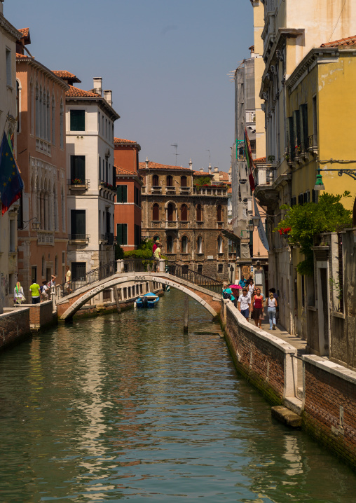 Venetian decayed facades and reflections on a canal, Veneto Region, Venice, Italy