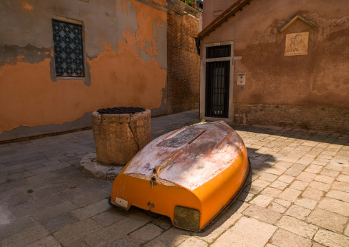 Wooden boat on a square in the city, Veneto Region, Venice, Italy