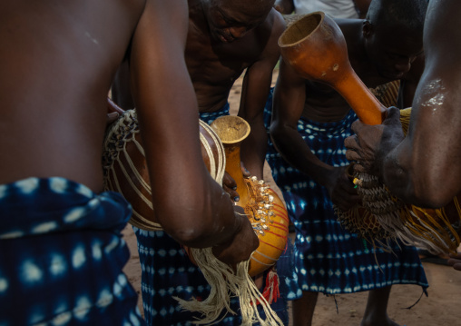 Musicians with shakers performing during a Goli sacred mask dance in Baule tribe, Région des Lacs, Bomizanbo, Ivory Coast