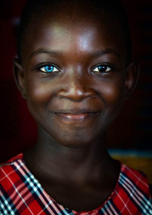 Beautiful african girl with heterochromia iridis causing two different colored eyes, Moyen-Comoé, Abengourou, Ivory Coast