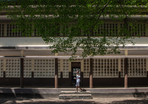 African girl in front of a school, Sud-Comoé, Grand-Bassam, Ivory Coast